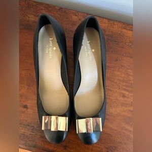 Kate Spade New York black leather block heels with gold metal ribbon